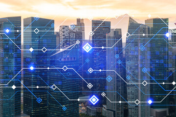 Glowing hologram of technological process, aerial panoramic cityscape of Singapore at sunset. The largest innovative hub of tech services in Asia. Multi exposure.