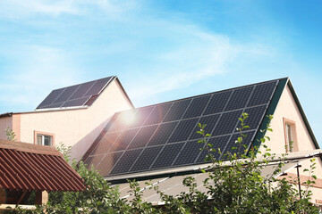 House with installed solar panels on roof. Alternative energy source