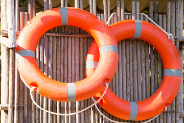 Life ring hanging on wooden wall