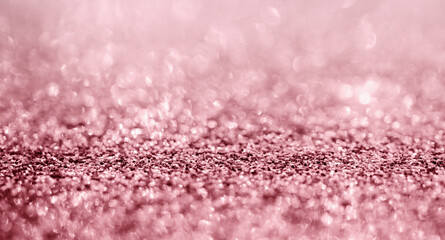 Abstract rose gold glitter sparkle texture with bokeh background