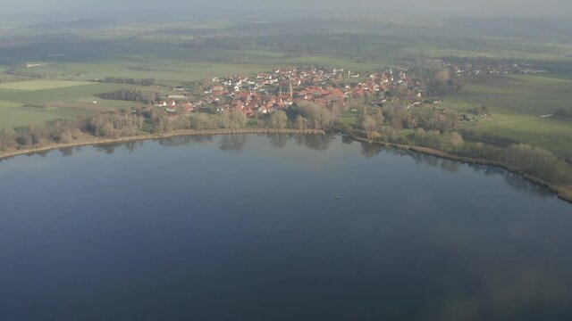 Drone Aerial of the Lake Seeburg Seeburger See on a beautiful sunday morning in the Harz national Park near G&ouml;ttingen in central germany.