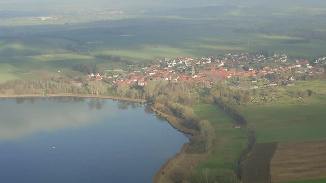 Drone Aerial of the Lake Seeburg Seeburger See on a beautiful sunday morning in the Harz national Park near G&ouml;ttingen in central germany.