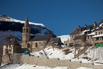 Panoramic view of Bagergue with the Romanesque Sant Feliú church on the left, covered by snow on a...