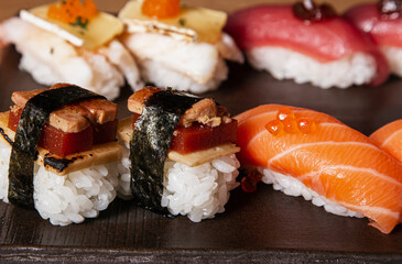 Close up of Japanese sushi food. Salmon nigiri, shrimp nigiri, unagi nigiri