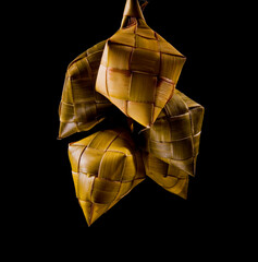 Puso Hanging Rice is rice wrapped and boiled in a diamond shaped casing of woven young coconut leaves. They are often hung in a bunch. In the Philippines, it is a street food icon.