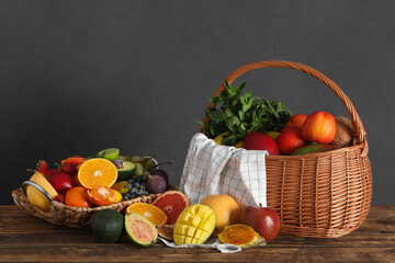 Fototapeta na wymiar Assortment of fresh exotic fruits on wooden table
