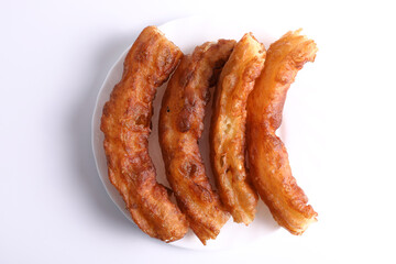 Breakfast with churros and cup of coffee with white background