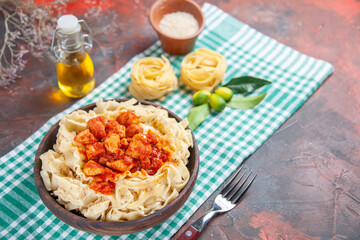 top view tasty cooked dough with chicken and sauce on dark floor pasta food dish