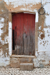 Old Wooden Door with Stone Step in Ancient Building 