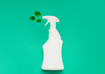 Biological spring cleaning. Empty white bottle mockup for cleaning. Eco sprayer green leaves, for...