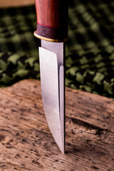 handmade knife on a background of shemag