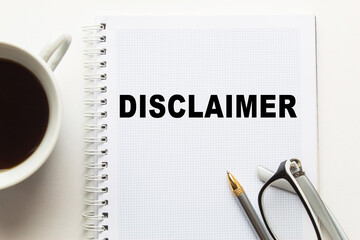 Notepad with inscriptions DISCLAIMER on a white background. business concept.