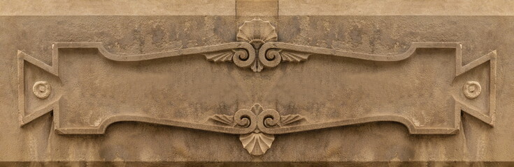 Elements of architectural decorations of buildings, gypsum stucco, plaster ornaments and patterns, wall texture. On the streets in Catalonia, public places. © Kozlik_mozlik