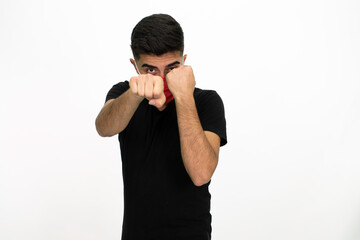 Young male model wearing a red medical face mask. He is wearing a black shirt. Isolated image and white background.