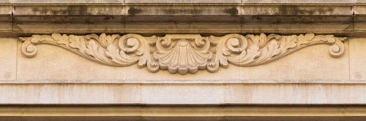 Elements of architectural decorations of buildings, gypsum stucco, plaster ornaments and patterns, wall texture. On the streets in Catalonia, public places. © Kozlik_mozlik