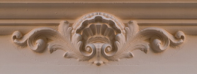 On the streets in Barcelona, public places. Elements of architectural decoration of buildings, plaster stucco, wall texture, plaster molding and patterns.  © Kozlik_mozlik