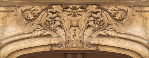 On the streets in Barcelona, public places. Elements of architectural decoration of buildings, plaster stucco, wall texture, plaster molding and patterns.  © Kozlik_mozlik