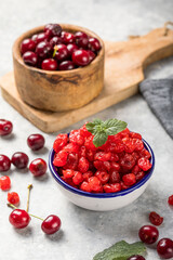 Dried cherries with fresh berry  on a white background