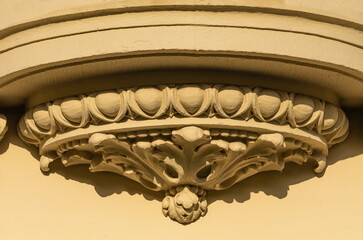 Elements of architectural decorations of buildings, gypsum stucco, plaster ornaments and patterns, wall texture. On the streets in Catalonia, public places. © Kozlik_mozlik