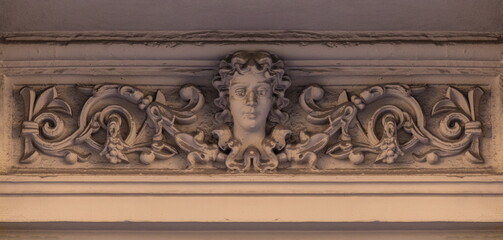 On the streets in Barcelona, public places. Elements of architectural decoration of buildings, plaster stucco, wall texture, plaster molding and patterns.  © Kozlik_mozlik