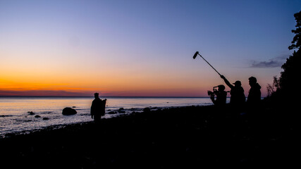 Filming crew next to the sea
