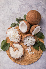 Whole and broken coconut with grated coconut flakes, chips, cubes.