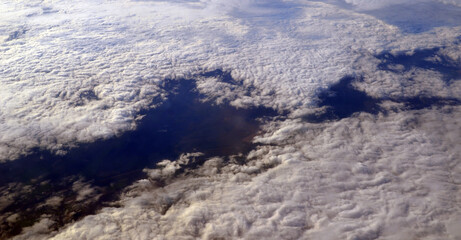 Aerial view of clouds and sky. Bird eye view from airplane window. Clouds panorama from airplane. Flight from Kiev to Sharm El Sheikh, Egypt.