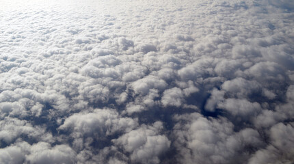 Aerial view of clouds and sky. Bird eye view from airplane window. Clouds panorama from airplane. Flight from Kiev to Sharm El Sheikh, Egypt.