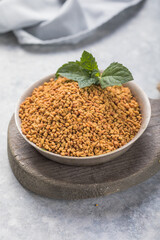 Organic fenugreek seeds in the bowl. Trigonella foenum-graecum