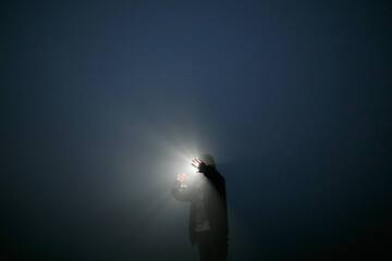 Obraz na płótnie Canvas Girl at night in the fog.