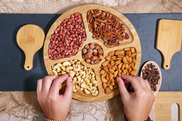 nuts on the table cashews almonds peanuts pecans. the view from the top, flat lay