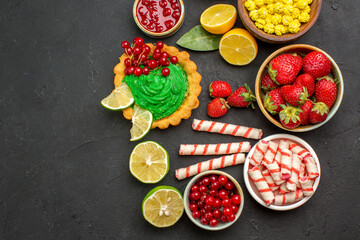 top view yummy cake with candies and fruits on dark background cookie biscuits sweet
