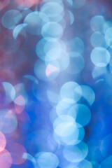 Flickering pink and blue blurred lights of Christmas background