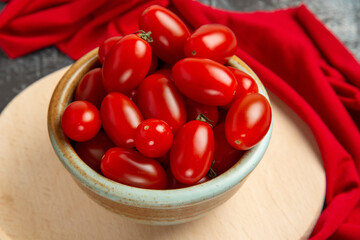 front view fresh tomatoes inside plate on a light-dark background salad red health food
