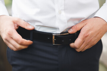 Young handsome man relaxing at his apartment in a hotel after business meeting