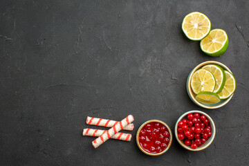 top view fresh lemon slices with berries on a dark background citrus photo