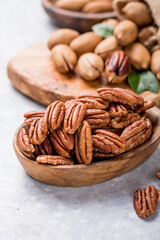Pecan nut unshelled. Pecans are rich in various trace elements and vitamins. A nut in a shell. Pecans are rich in various trace elements and vitamins