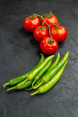 front view fresh spicy peppers with red tomatoes on dark background food salad ripe