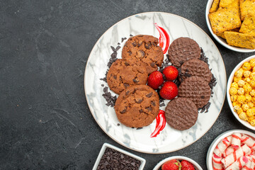 top view delicious choco biscuits with snacks on a dark background photo sweet cookie