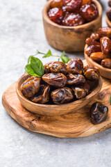 Dates or dattes palm fruit in wooden bowl is snack healthy.Creative layout made of dried dates. Flat lay. Food concept. Fruits dates. Dates Palm fruit isolated on white. Dried fruits. Healthy diet.