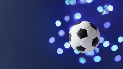 Naklejka premium Traditional soccer ball flying over blue background.