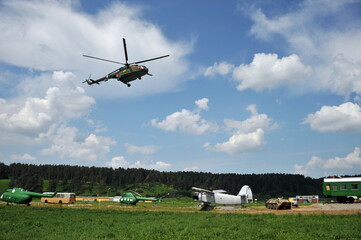 Fototapeta na wymiar Russian mi-8 military helicopter flies over army training ground