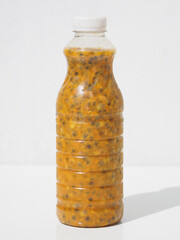 Fresh passion juice (maracuya) in the bottle.