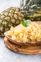 Candide fruit pineapple cubes,   on white background