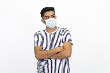 Young male wearing a medical face mask. Isolated image and white background.