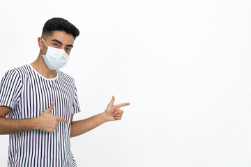 Young male wearing a medical face mask. Isolated image and white background.