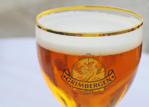 ORLEANS, FRANCE - JULY 4, 2015: The traditional Belgian blond abbey beer brand Grimbergen with the phenix logo is very popular in Orleans and other parts of France