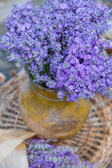 Bouquet of lavender in an old clay pot. Aromatherapy. Lavender mood. Top view. Vertical image.