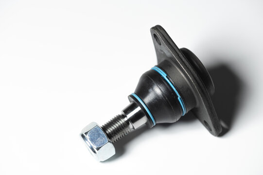 Ball joint car suspension on a gray background. New spare parts axel car elements