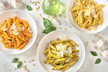 Penne pasta with various pesto sauces
